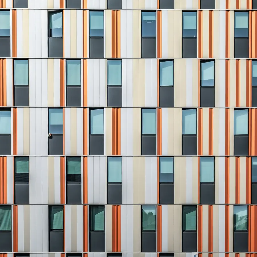 Building facade finished in colored cladding panels