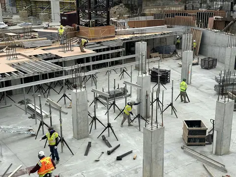 Concrete slab and column formwork on an active construction site